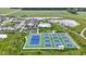 Aerial shot shows community tennis courts, pool, clubhouse, and pond, offering residents many amenities at 19959 Cowie Ln, Westfield, IN 46074