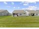 Spacious backyard with well-maintained lawn and patio area, ideal for outdoor gatherings and recreation at 19959 Cowie Ln, Westfield, IN 46074