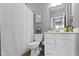A bathroom featuring white cabinets, fixtures, and a shower with neutral walls at 19959 Cowie Ln, Westfield, IN 46074
