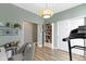 Bright bedroom featuring a treadmill, bookshelf, and neutral walls, offering a tranquil workout space at 19959 Cowie Ln, Westfield, IN 46074