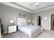 Spacious bedroom with a ceiling fan, neutral walls, and a walk-in closet is illuminated with recessed lights at 19959 Cowie Ln, Westfield, IN 46074