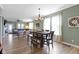 Dining room with dark wood table, chair set, chandelier lighting, and an open concept at 19959 Cowie Ln, Westfield, IN 46074