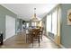 Dining room with a view of living room, featuring hardwood floors and natural light at 19959 Cowie Ln, Westfield, IN 46074
