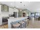 This spacious kitchen features stainless steel appliances, a large island, and stylish pendant lighting at 19959 Cowie Ln, Westfield, IN 46074