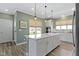 Modern kitchen features a large center island, stainless steel appliances, and stylish pendant lights at 19959 Cowie Ln, Westfield, IN 46074