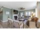 Cozy living room with a fireplace, comfortable seating, and plenty of natural light at 19959 Cowie Ln, Westfield, IN 46074