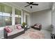 Inviting screened porch with wicker furniture and decorative pillows, providing a comfortable outdoor living area at 19959 Cowie Ln, Westfield, IN 46074