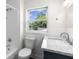 Bathroom featuring new fixtures, vanity, bathtub, and natural light from the window at 2001 S Jefferson St, Muncie, IN 47302
