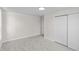 Bedroom featuring neutral carpet and paint and a sliding-door closet at 2001 S Jefferson St, Muncie, IN 47302
