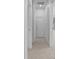 Hallway with neutral carpet and paint leading to multiple rooms at 2001 S Jefferson St, Muncie, IN 47302