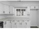 Close up on the kitchen counter space with white cabinets and stainless steel handles at 2001 S Jefferson St, Muncie, IN 47302