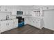 Updated kitchen featuring stainless steel appliances, white cabinetry and ample countertop space at 2001 S Jefferson St, Muncie, IN 47302