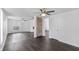 Spacious living area with hardwood floors, brick fireplace, ceiling fans, and ample natural light at 2001 S Jefferson St, Muncie, IN 47302