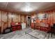 This spacious basement area features paneled walls, concrete floors, and ample space for storage and activities at 2020 Rosedale Dr, Indianapolis, IN 46227