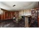 Open finished basement with bar, built-in shelving, and vintage-style decor at 2020 Rosedale Dr, Indianapolis, IN 46227