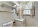 Clean bathroom featuring vanity and neutral tile work at 2020 Rosedale Dr, Indianapolis, IN 46227