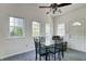 Bright dining area features many windows and a comfortable chair at 2020 Rosedale Dr, Indianapolis, IN 46227