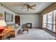 Inviting living room with neutral carpet, ceiling fan, and comfortable furnishings at 2020 Rosedale Dr, Indianapolis, IN 46227