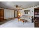 Traditional living room with neutral carpet, ceiling fan, and access to other rooms at 2020 Rosedale Dr, Indianapolis, IN 46227