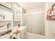 Cozy bathroom featuring a vanity with a sink, updated fixtures, and a framed mirror, all enhanced by modern lighting at 2113 W Barcelona Dr, Muncie, IN 47304