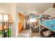 Bedroom featuring an innovative layout with a cozy loft bed, a functional closet, and relaxing seating at 2113 W Barcelona Dr, Muncie, IN 47304