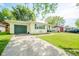 Charming single-story home with a garage, a well-maintained lawn, and inviting curb appeal, perfect for comfortable living at 2113 W Barcelona Dr, Muncie, IN 47304