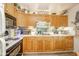 Traditional kitchen features wood cabinets, stainless steel appliances, and durable countertops at 2113 W Barcelona Dr, Muncie, IN 47304