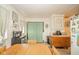 Kitchen with wood table, stainless steel mini fridge and curtains at 2113 W Barcelona Dr, Muncie, IN 47304