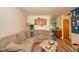 Spacious living room features a comfortable sectional sofa, and durable wood floors at 2113 W Barcelona Dr, Muncie, IN 47304
