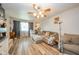 Inviting living room with new hardwood floors and lots of natural light at 2113 W Barcelona Dr, Muncie, IN 47304