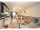 Living room featuring new hardwood floors, plenty of natural light, and comfortable seating at 2113 W Barcelona Dr, Muncie, IN 47304