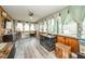 Sunroom with lots of windows, a ceiling fan and luxury vinyl plank flooring at 2113 W Barcelona Dr, Muncie, IN 47304