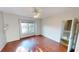 This bedroom is bright and airy with a window and a ceiling fan at 2259 Colfax Ln # 2259, Indianapolis, IN 46260