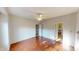 Spacious bedroom featuring a ceiling fan, hardwood floors, natural light, and neutral paint at 2259 Colfax Ln # 2259, Indianapolis, IN 46260
