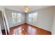 This bedroom is bright and airy with hardwood floors and two windows at 2259 Colfax Ln # 2259, Indianapolis, IN 46260