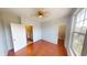 Comfortable bedroom with hardwood floors, featuring a ceiling fan, natural light, and neutral paint at 2259 Colfax Ln # 2259, Indianapolis, IN 46260