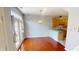Dining area featuring beautiful hardwood floors, modern lighting, and easy kitchen access at 2259 Colfax Ln # 2259, Indianapolis, IN 46260