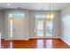 Bright entryway with double doors and glossy wood floors at 2259 Colfax Ln # 2259, Indianapolis, IN 46260