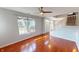 Open-concept living room with gleaming hardwood floors and a staircase at 2259 Colfax Ln # 2259, Indianapolis, IN 46260