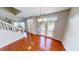 Bright living space showcasing hardwood floors and easy access to the staircase and outdoor living space at 2259 Colfax Ln # 2259, Indianapolis, IN 46260
