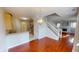 Open layout connects kitchen, dining, and living areas, with hardwood floors and natural light at 2259 Colfax Ln # 2259, Indianapolis, IN 46260