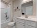 Bright bathroom featuring a shower-tub combo, a toilet and a white sink vanity with a mirror at 2500 Sand Hollow Dr, Lebanon, IN 46052