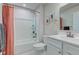Bright bathroom featuring a shower-tub combo, a toilet and a white sink vanity with a mirror at 2500 Sand Hollow Dr, Lebanon, IN 46052