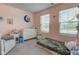 This bedroom features two windows, a side chair, and a dresser at 2500 Sand Hollow Dr, Lebanon, IN 46052
