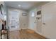 Bright entry area with coat rack, wood-look floors, and easy access to the home's layout at 2500 Sand Hollow Dr, Lebanon, IN 46052