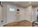 Well-lit foyer with wood-look flooring and convenient coat closet for guests at 2500 Sand Hollow Dr, Lebanon, IN 46052