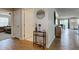 Open hallway connecting living spaces with stylish flooring and neutral decor, offering views into other rooms at 2500 Sand Hollow Dr, Lebanon, IN 46052