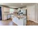 Bright kitchen featuring white cabinets, stainless appliances, and a granite island at 2500 Sand Hollow Dr, Lebanon, IN 46052