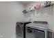 This laundry room has both a washer and a dryer, as well as an overhead wire shelf at 2500 Sand Hollow Dr, Lebanon, IN 46052