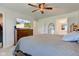 This main bedroom features a ceiling fan, and a TV sitting on a wooden dresser at 2500 Sand Hollow Dr, Lebanon, IN 46052